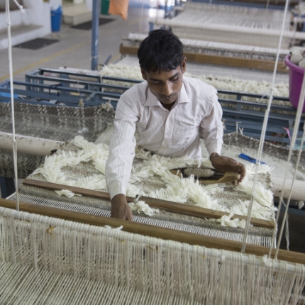 Munir Ahmad working at the first-ever Fair Trade rug factory